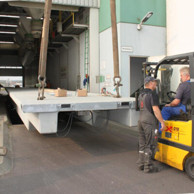 The new weighbridge is rolled over the pit, hydraulically lowered, then the load cells are mounted